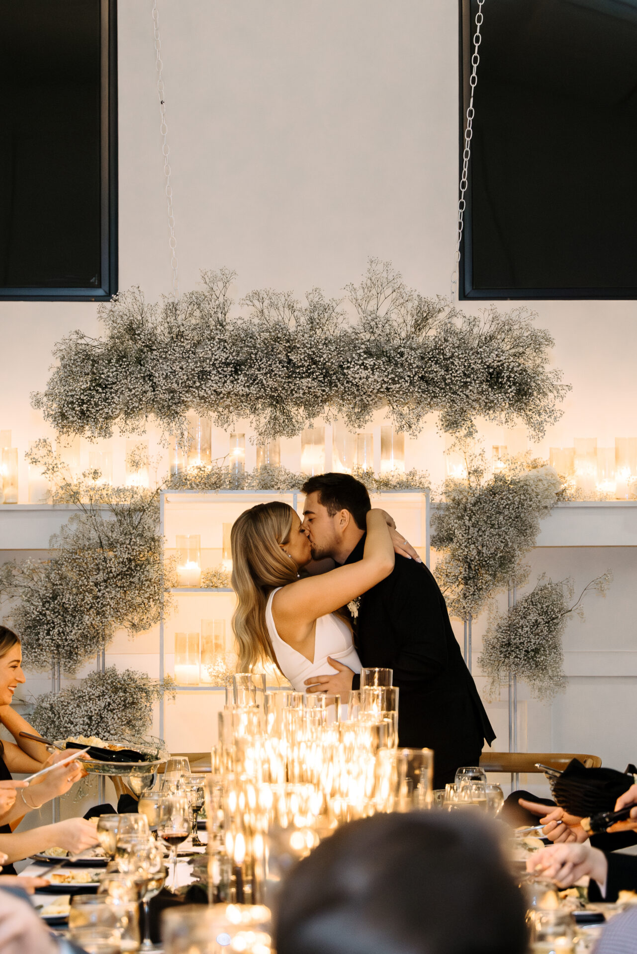 Couple kissing at wedding reception at Woodhaven Weddings & Events in Minnesota